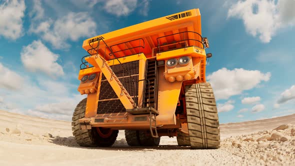 Animation of the yellow dump truck driving through the vast dig site. 4K HD