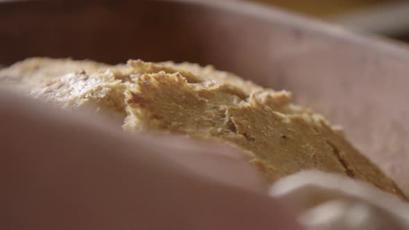 BAKING - Delicious, freshly baked sourdough bread, slow motion close up