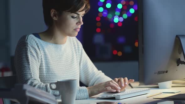 Young woman working late at night