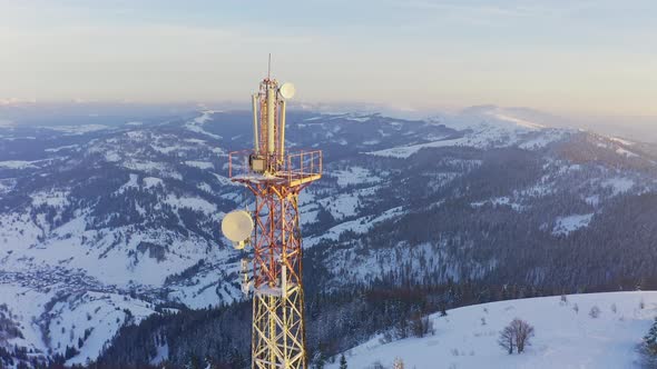 Flying Over Radio Communications Tower Mountain Snow Covered Winter Landscape