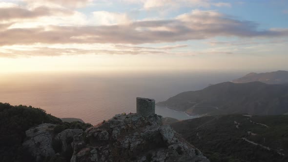 Aerial Orbital View of Old and Ancient Building Looking at the Sea Panorama During Sunsetgreen