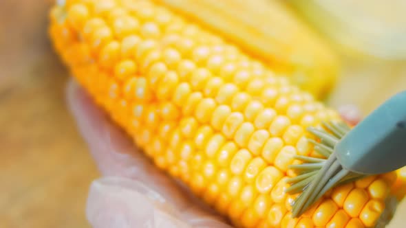 Grease with Oil and Put on the Grill Three Corn Plants