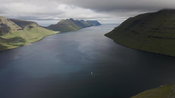 Drone Over Hikers On Klakkur Mountain Summit With Sea Beyond