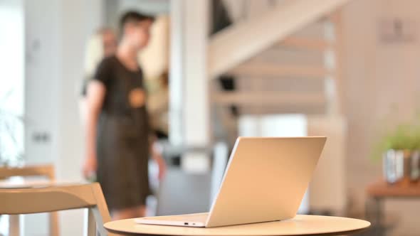 Young Latin Woman Doing Video Call on Laptop at Home