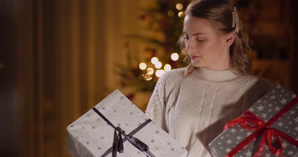 Happy Woman Unboxing Christmas Gift