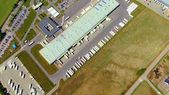 Aerial view of warehouse storages or industrial factory or logistics center from above. Top view of