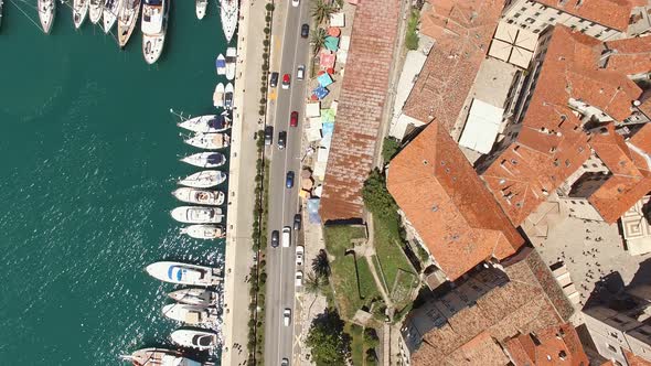 Motor Boats Stand Along the Coastline of the Old Town of Kotor Montenegro