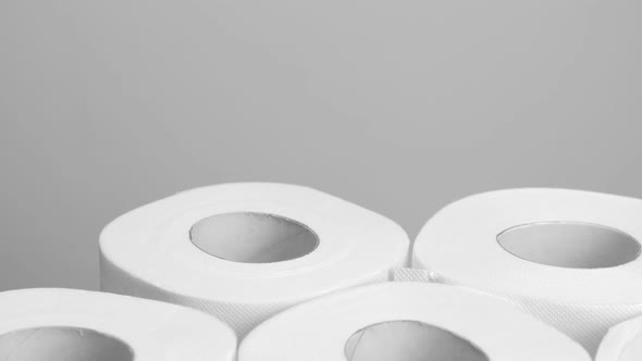 A Lot of Toilet Paper on Gray Background