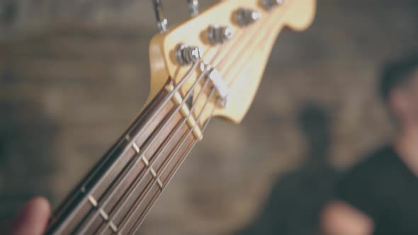 Close-up of Male Hands Rock Musician Playing Electric Guitar