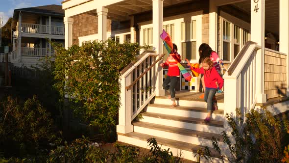 Children walk down steps on way to beach