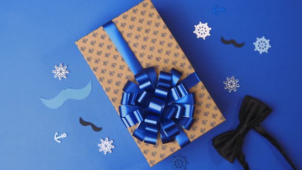 Gluing the Bow To the Present Box for Men, Wrapping the Present, Parcel Decoration