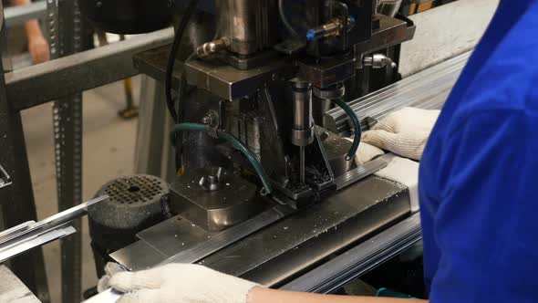 Girl at Factory Drill Holes in Detail