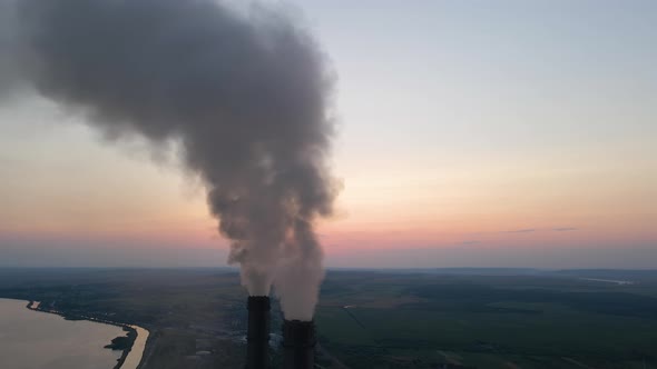 Aerial View of Coal Power Plant High Pipes with Black Smoke Moving Upwards Polluting Atmosphere at