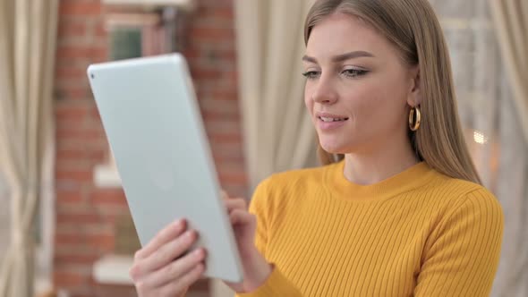 Portrait of Cheerful Female Designer Using Tablet