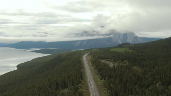 Beautiful View of Road Alongside Scenic Lake