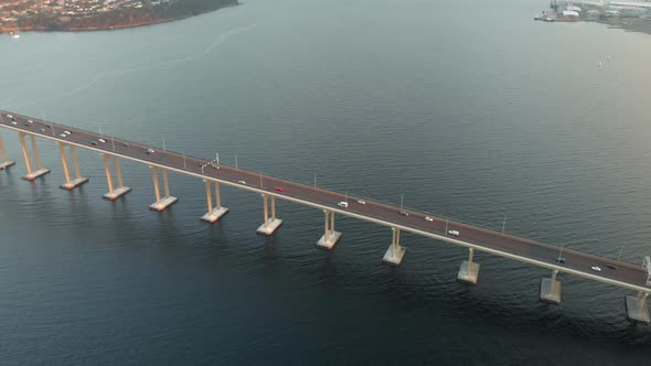 Aerial shot over Tasman bridge highway at sunset. (Drone footage)