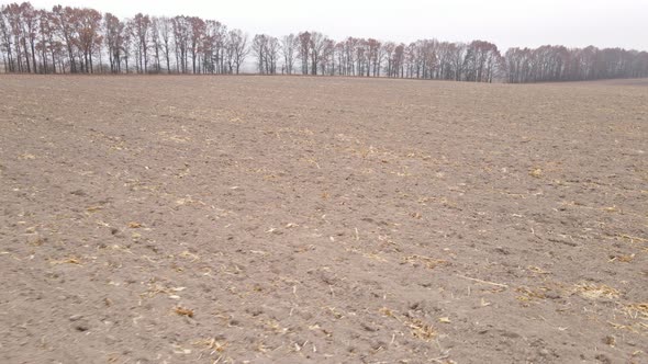 Empty Plowed Field in Autumn Aerial View