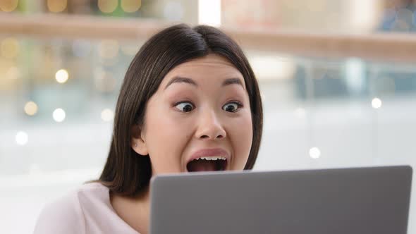 Overjoyed Asian Woman Wins Achieves Goal Triumph Says Wow Feels Winner Happy Looking at Laptop