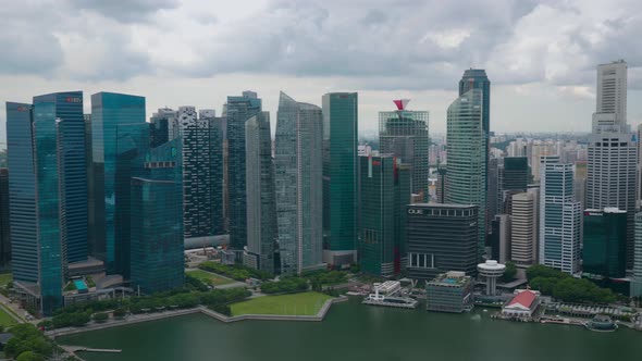 Aerial view of Singapore skyline. Left to right pan of the Singapore skyline including the CBD, Merl