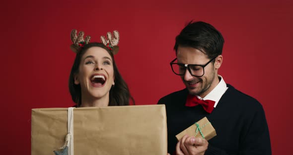 Christmas nerd couple with presents