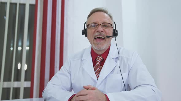 Happy doctor looking at camera