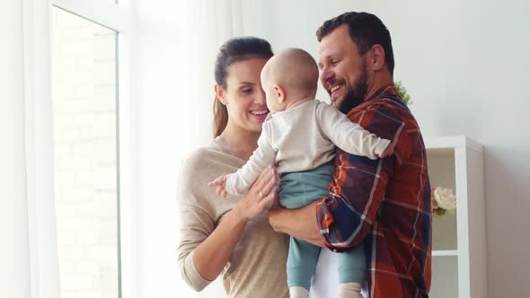 Happy Family with Baby at Home