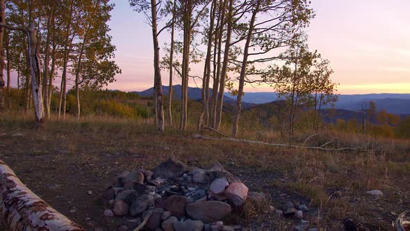 Panning view of abandoned campsite at sunrise