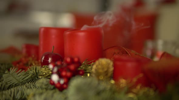 Christmas Advent Candles Get Blown Out on a Table in an Apartment - Closeup