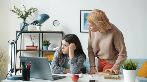 Abusive Mother Yelling at Daughter Fighting with Child When Teenager Is Doing Homework