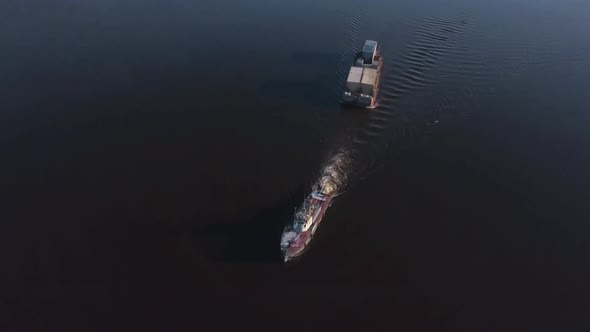 Top View of Boat with Cargo Floating on River
