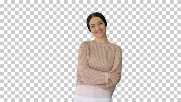 Smiling young woman posing with arms crossed, Alpha Channel