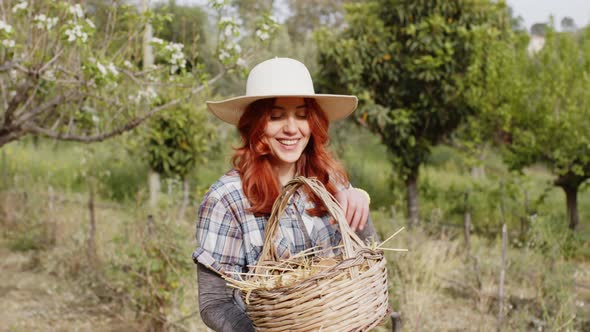 Girl with Basket Full of Chicken Eggs