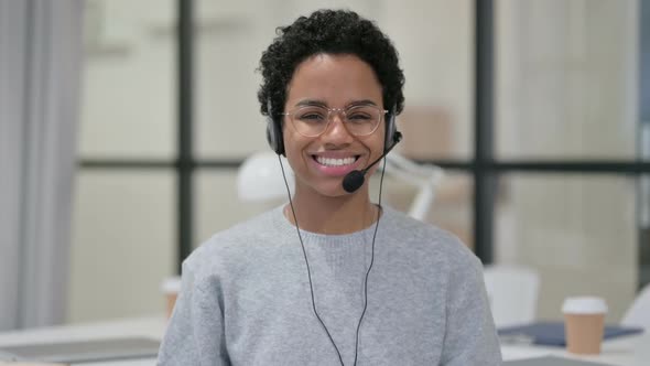 Smiling African Woman Wearing Headset with Mic