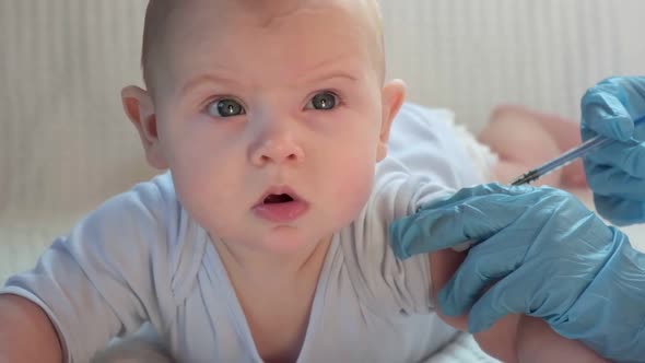 Pediatrician Vaccinating Newborn Baby