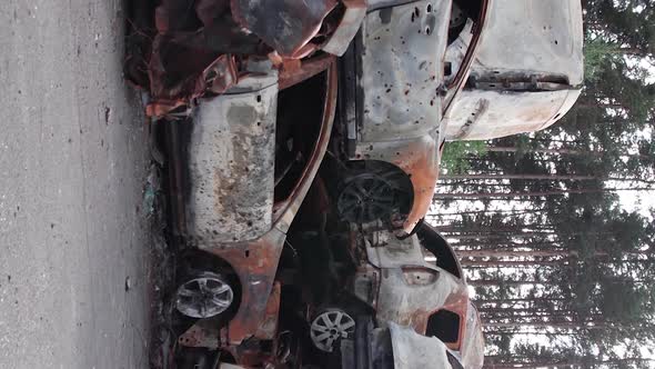 Vertical Video Irpin Bucha District  Destroyed Cars During the War in Ukraine