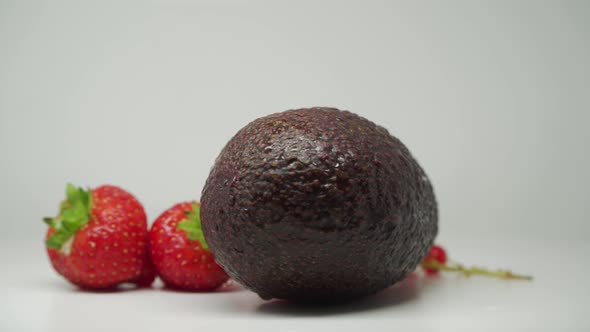 Avocado, Strawberries And Red Currants - Set Of Delicious And Fresh Fruits For Dessert - Close Up Sh