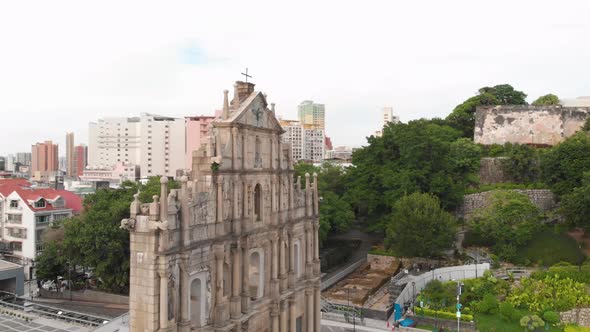 Rotating aerial shot revealing famous Ruins of Saint Paul's, Macau. From side view