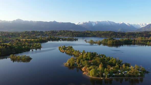 Flight over the campig island of Buchau in lake Staffelsee in Bavaria, Germany