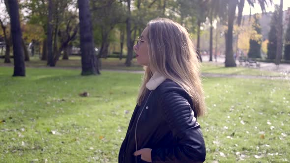 Young woman walking in park