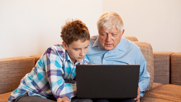 Young Boy and Old Person Learn Laptop alt