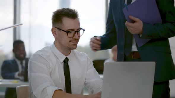 Team Leader Encourage and Pat on Shoulder Expressing Positive Successful To Young Man Employee