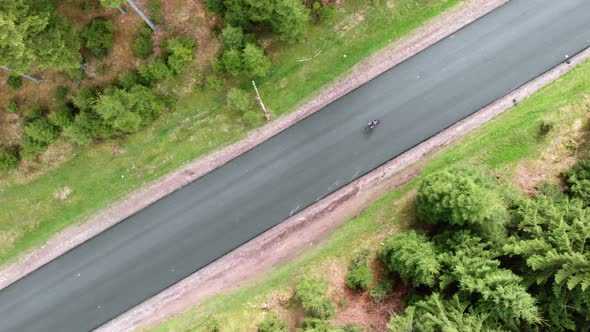 Cyclist cycling in helmet on bicycle top aerial view