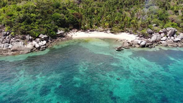 Bungalows and Green Coconut Palms on Tropical Beach. Cottages on Sandy Shore of Diving and