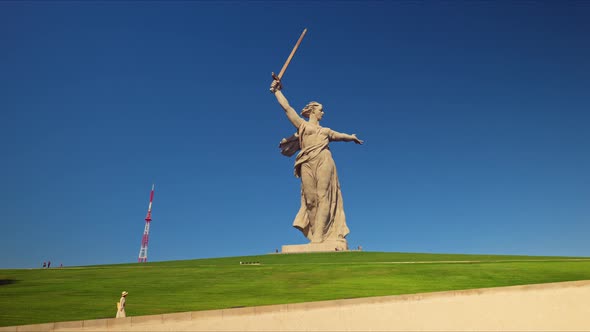 A young girl climbing to the Motherland Monument. Russia, Volgograd