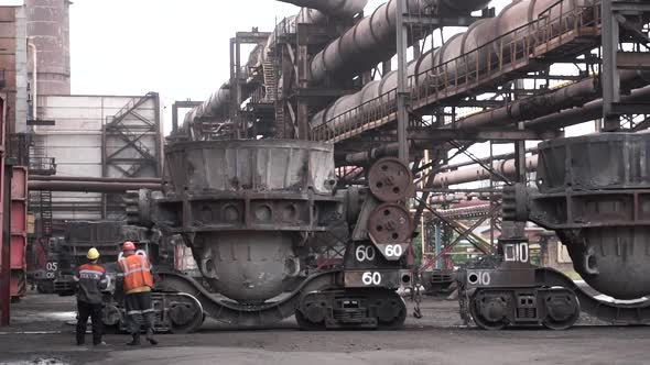 Metal Melting Vats Being Transported