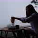 A woman preparing to make drip coffee with a beautiful nature view on foggy day - VideoHive Item for Sale