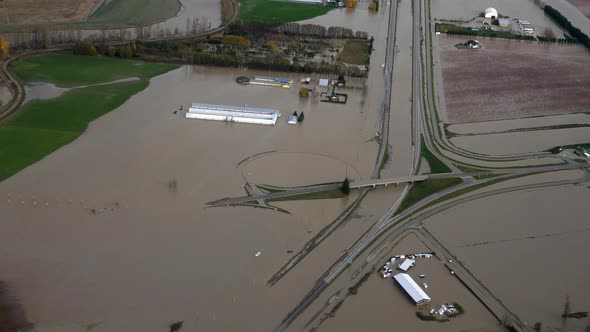 Floodwaters Cover Highway And Fields Due To Heavy Rains In Abbotsford, British Columbia, Canada. - a