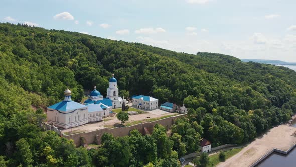 Makaryev Monastery in Russia Near the River Surrounded By Green Forest alt