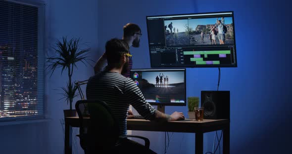 Young Man Editing Video Inside the Room