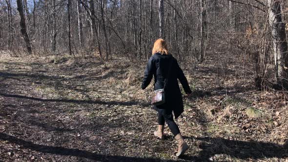 Slow motion of modern woman  leading through forest 1920X1080 HD footage - Female in the nature walk